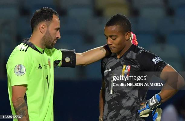 Colombia's goalkeeper David Ospina and Venezuela's goalkeeper Wuilker Farinez talk at the end of their Conmebol Copa America 2021 football tournament...
