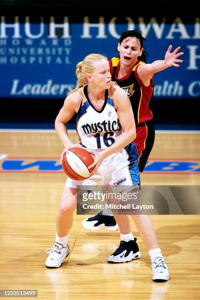 June 19: Andrea Nagy of the Washington Mystics looks to moves the ball against Andy Brondello of the Detroit Shock on June 19, 2000 at MCI Center in...
