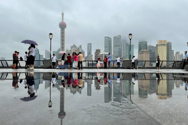 Capturing the Neon Pulse of Shanghai's Bund Waterfront 1 Tourists at Shanghai Bund Waterfront