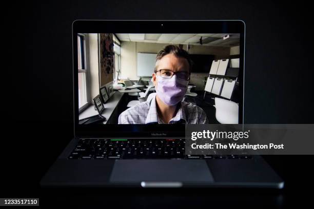 Ben White, a private middle school English teacher at the Webb School of Knoxville, poses for a portrait in his classroom in Knoxville, TN as seen...