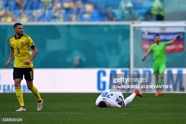 Slovakia's forward Robert Mak lies on the pitch during the UEFA EURO 2020 Group E football match between Sweden and Slovakia at Saint Petersburg...