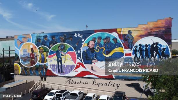 The "Absolute Equality" mural in Galveston, Texas, on June 16, 2021. - The mural, by artists Reginald C. Adams, Dantrel Boone, Samson Adenugba, and...