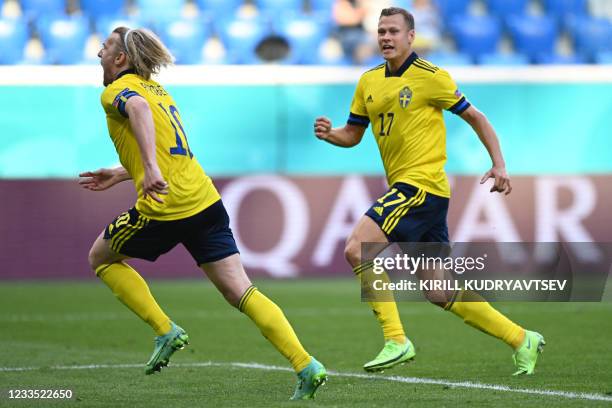 Sweden's midfielder Emil Forsberg celebrates with Sweden's midfielder Viktor Claesson after scoring a goal during the UEFA EURO 2020 Group E football...
