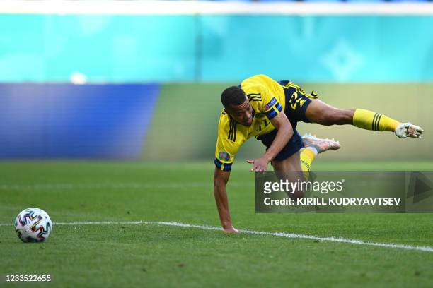 Sweden's midfielder Robin Quaison is fouled leading to a penalty during the UEFA EURO 2020 Group E football match between Sweden and Slovakia at...