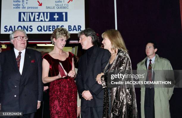 Princess of Wales Diana flanked by Mayor of Lille Pierre Mauroy speaks with British singer Paul McCartney and his wife Linda before a concert of...