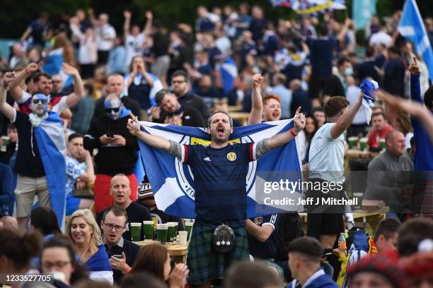 Scotland fans cheer as they support their team in the Euro 2020 game against England on June 18, 2021 in Glasgow, Scotland. England v Scotland is not...