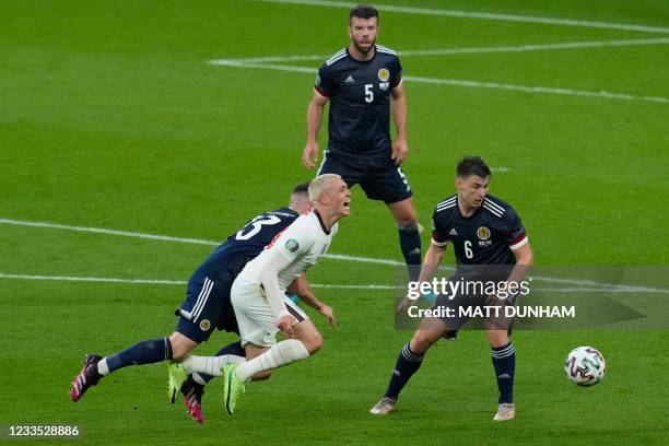 Scotland's midfielder Billy Gilmour challenges England's midfielder Phil Foden during the UEFA EURO 2020 Group D football match between England and...