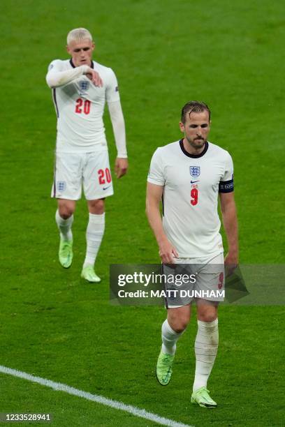 England's midfielder Phil Foden and England's forward Harry Kane walk off the pitch at half-time during the UEFA EURO 2020 Group D football match...