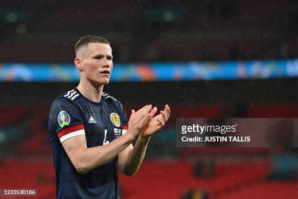 Scotland's midfielder Scott McTominay claps after the UEFA EURO 2020 Group D football match between England and Scotland at Wembley Stadium in London...