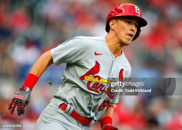 Tommy Edman of the St. Louis Cardinals rounds first after hitting a double in the first inning of an MLB game against the Atlanta Braves at Truist...