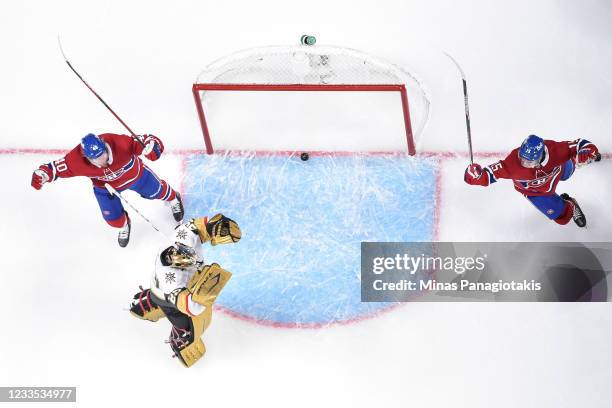 Joel Armia of the Montreal Canadiens and Jesperi Kotkaniemi celebrate a goal by teammate Josh Anderson , near goaltender Marc-Andre Fleury of the...