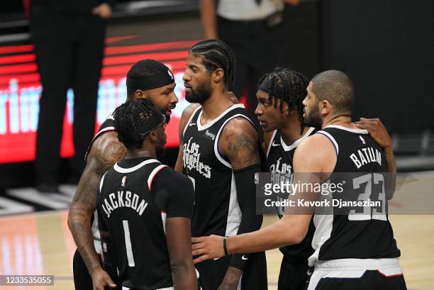 Reggie Jackson of the Los Angeles Clippers, Marcus Morris Sr. #8, Paul George, Terance Mann, and Nicolas Batum of the Los Angeles Clippers huddle...