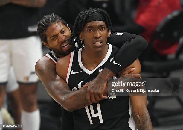 Paul George of the Los Angeles Clippers hugs Terance Mann of the Los Angeles Clippers after he scored a basket against Utah Jazz during the first...