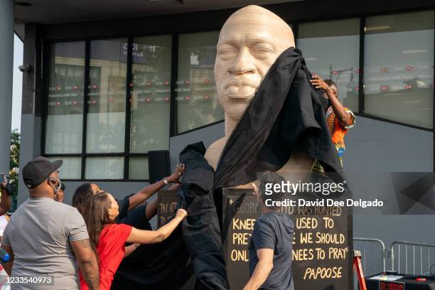 Statue of George Floyd is unveiled at Flatbush Junction on June 19 in the Brooklyn borough of New York City. Mr. Floyds murder, at the hands of...