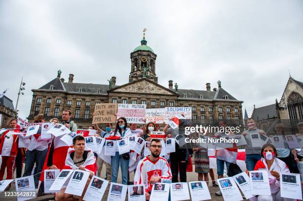 The Belarusian community in The Netherlands is posing for the press with photos of the 501 political prisoners in Belarus during a protest organized...