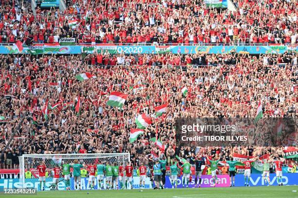 Hungary's players celebrate with the fans after the UEFA EURO 2020 Group F football match between Hungary and France at Puskas Arena in Budapest on...