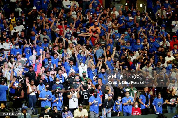 Fans react as the LA Clippers beat the Utah Jazz to advance to the Western Conference NBA Playoffs at Staples Center on June 18, 2021 in Los Angeles,...