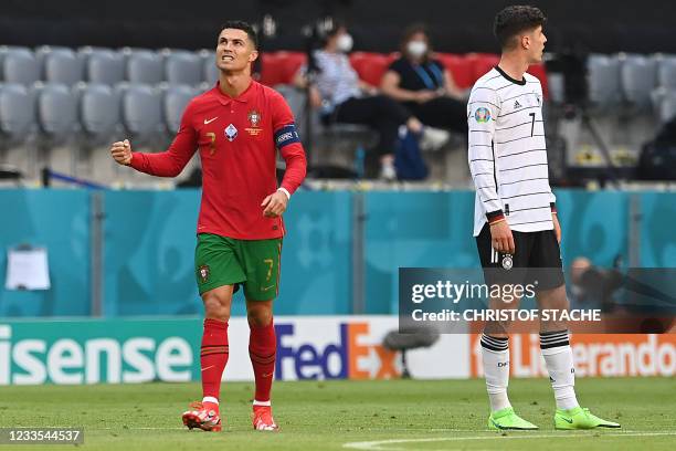 Portugal's forward Cristiano Ronaldo celebrates scoring his team's first goal during the UEFA EURO 2020 Group F football match between Portugal and...