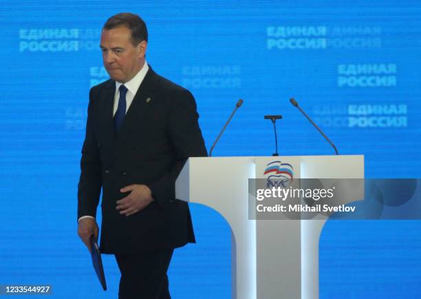 Russian Security Council Vice Chairman Dmitry Medvedev leaves the scene after his speech at the 20th Congress of the United Russia Party, on June 19,...