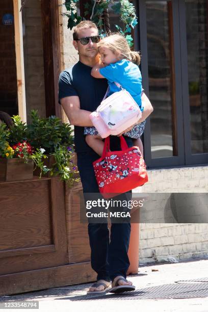 Bradley Cooper is seen out with his daughter Lea on June 18, 2021 in New York City.