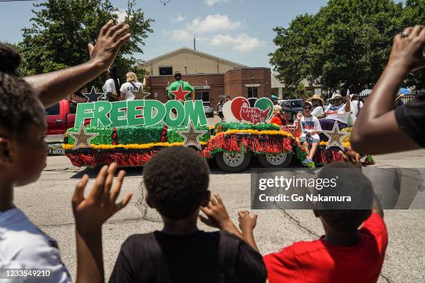 Spectators watch Juneteenth Parade commemorating the end of slavery in the United States on June 19, 2021 in Galveston, Texas. Juneteenth...