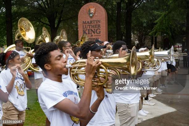 Band plays in front of the Martin Luther King Junior Center before participating in a parade to celebrate Juneteenth on June 19, 2021 in Atlanta,...