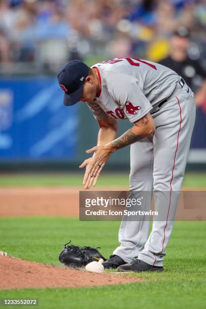 Boston pitcher Yacksel Rios uses the rosin bag against the Kansas City Royals in the game against the Kansas City Royals against the Kansas City...