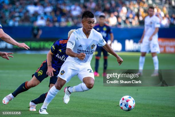 Efrain Alvarez of Los Angeles Galaxy controls the ball against Seattle Sounders during a game during a game at the Dignity Health Sports Park on June...