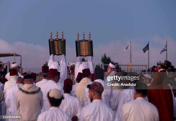 Samaritan men gather to pray at Mount Gerizim during the Shavuot, the Feast of Weeks, in Nablus, West Bank, on June 20, 2021.