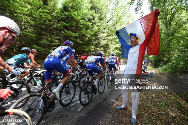 Supporter greets competitors during the French cycling championship in Epinal, eastern France, on June 20, 2021.