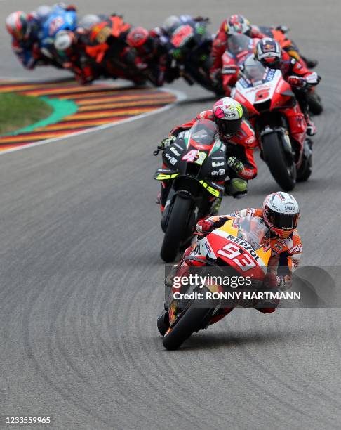 Honda Spanish rider Marc Marquez steers his motorbike during the German MotoGP Grand Prix at the Sachsenring racing circuit in Hohenstein-Ernstthal...