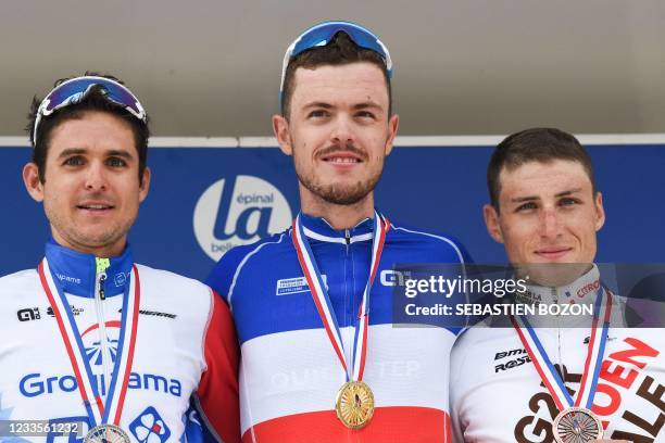 Deceunick Quick-Step winner Remi Cavagna poses on the podium next to second-place Groupama FDJ Rudy Molard and third-placed AG2R CITROEN Damien Touze...