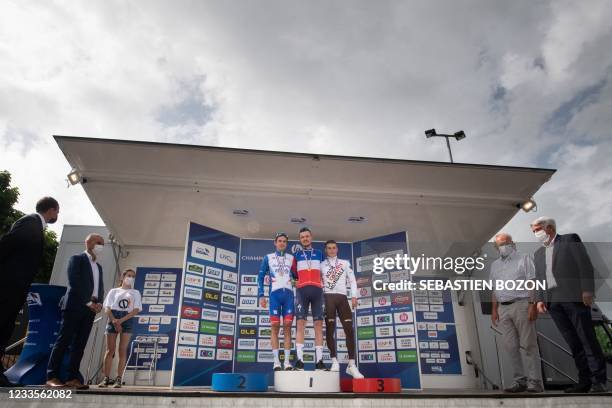 Deceunick Quick-Step winner Remi Cavagna poses on the podium next to second-place Groupama FDJ Rudy Molard and third-placed AG2R CITROEN Damien Touze...