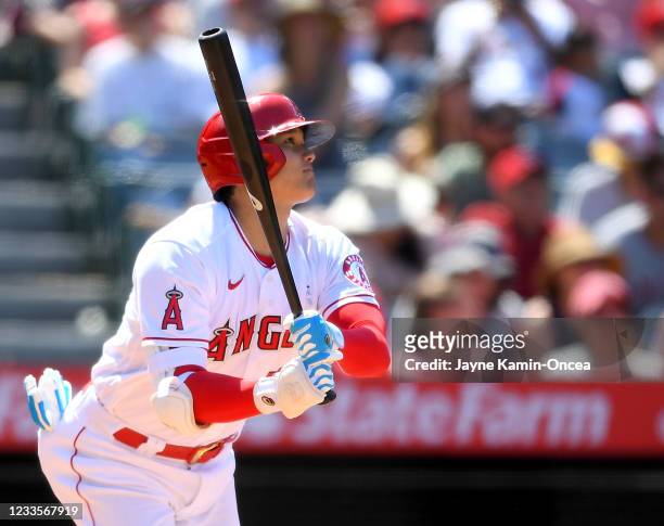 Shohei Ohtani of the Los Angeles Angels watches as the ball clears the wall on a two-run home run in the fifth inning of the game against the Detroit...