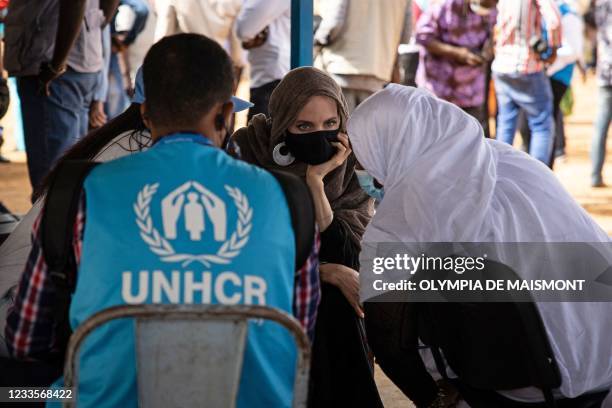 Actress Angelina Jolie, United Nations High Commissioner for Refugees special envoy, speaks with Malian refugees in Goudebou, a camp that welcomes...