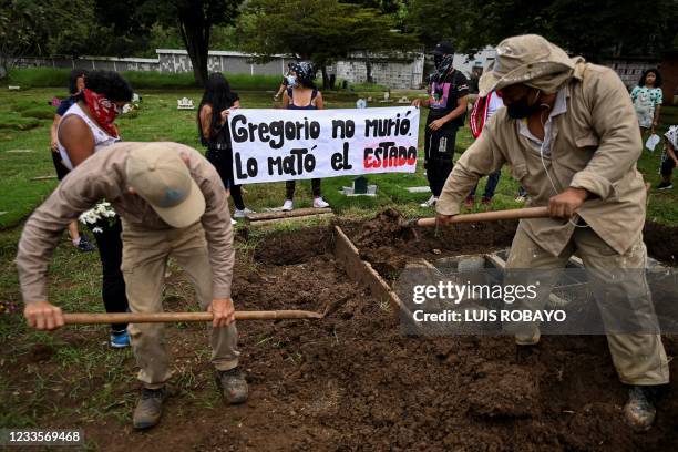 Signal that reads "Gregorio didn't die, the state killed him" is seen during the funeral of Angelvis Gregorio Bello, a demonstrator who was found...