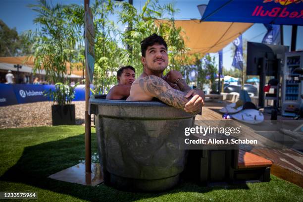 Lemoore, CA Gabriel Medina, front, two-time WSL world champion from Brazil, and Seth Muniz, of Hawaii, sit in the ice tub while watching the action...