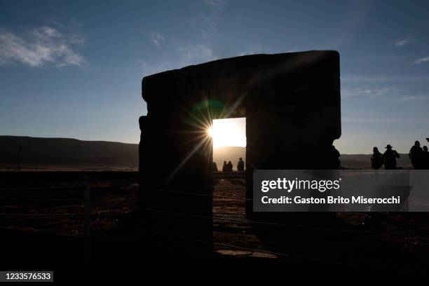 The first rays of the sun shine through the Puerta del Sol during the Winter Solstice on June 21, 2021 in Tiwanaku, Bolivia. The winter solstice...
