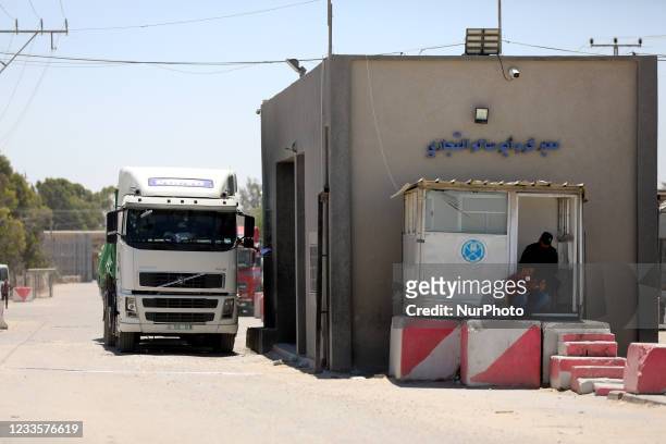 Truck carrying rice enters Gaza at the Kerem Shalom cargo crossing with Israel, in Rafah, southern Gaza Strip, Monday, June 21, 2021. Israel on...