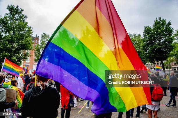 Activists take to the streets during a demonstration demanding that the European Union take action against a Hungarian anti-LGBTI law at the...