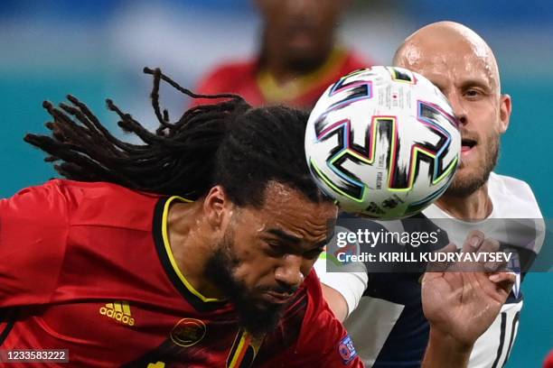 Belgium's defender Jason Denayer heads the ball ahead of Finland's forward Teemu Pukki during the UEFA EURO 2020 Group B football match between...