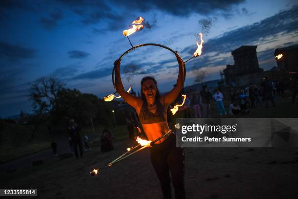 Performers from Fire Club Edinburgh mark the summer solstice during a fire festival on Calton Hill on June 21, 2021 in Edinburgh, United Kingdom. The...