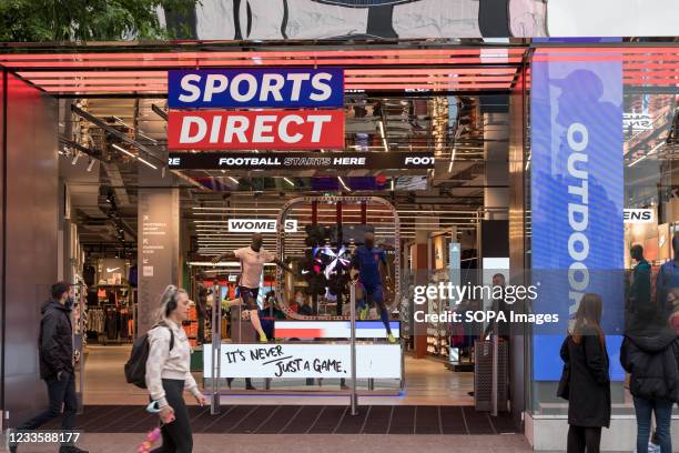 Sports Direct logo is seen at one of their stores on Oxford Street in London.