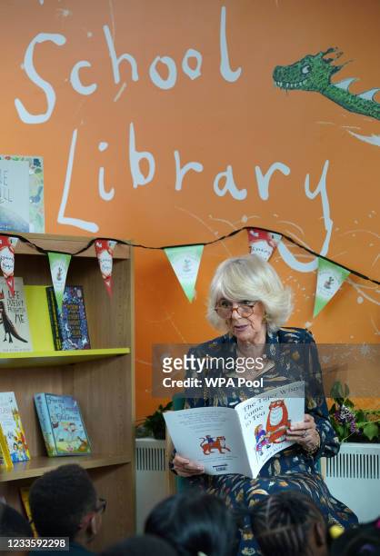 Camilla, Duchess of Cornwall, Patron of BookTrust, reads to schoolchildren during her visit to Griffin Primary School, Nine Elms, to open the new...