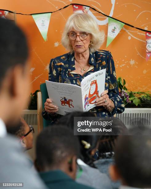 Camilla, Duchess of Cornwall, Patron of BookTrust, reads to schoolchildren during her visit to Griffin Primary School, Nine Elms, to open the new...