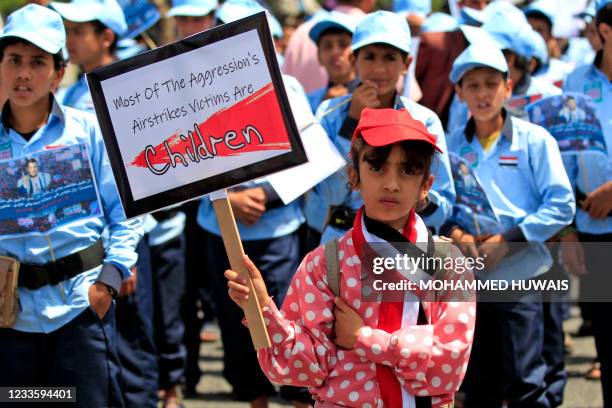 Yemeni children protest against a decision by the UN chief to drop from the "List of Shame" the Saudi-Led Coalition, an addendum to the UNs report...