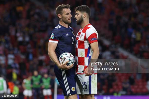 Croatia's defender Josko Gvardiol confronts Scotland's defender Stephen O'Donnell after a challenge during the UEFA EURO 2020 Group D football match...