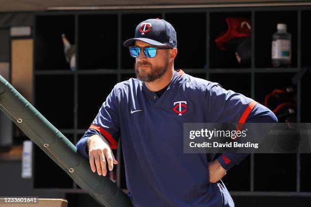 Rocco Baldelli of the Minnesota Twins looks on from the dugout in the seventh inning of the game against the Cincinnati Reds at Target Field on June...