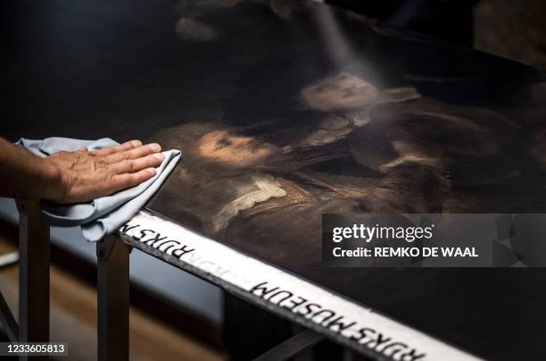 Section of the 1642 'Night Watch' is cleaned at the Rijksmuseum Museum during 'Operation Night Watch', the largest ever investigation into the...