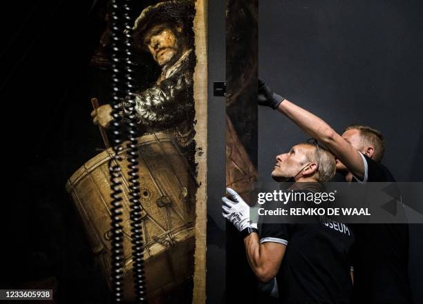 The frame is added to the 1642 'Night Watch' at the Rijksmuseum Museum during 'Operation Night Watch', the largest ever investigation into the...